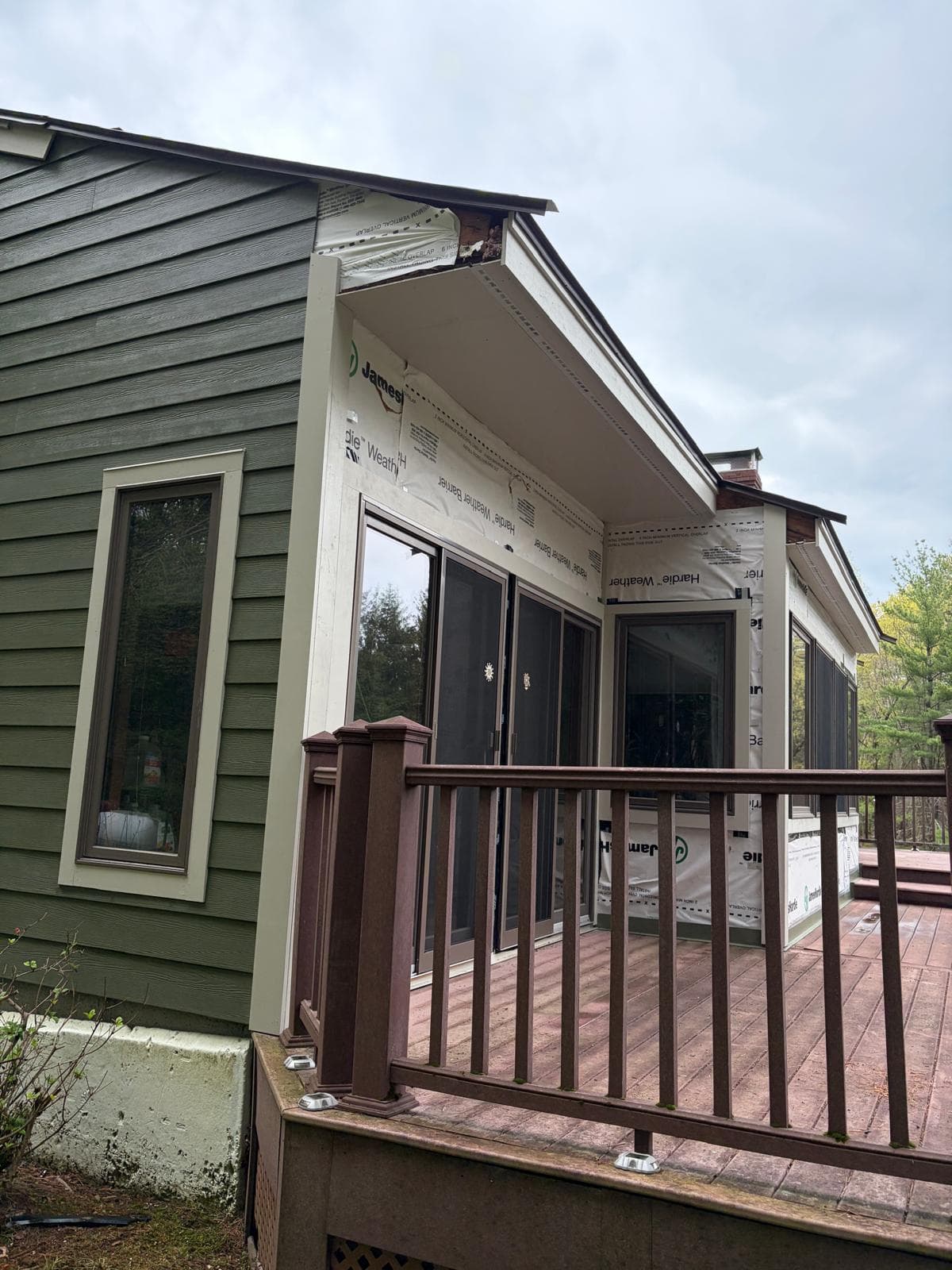 Covered porch area on Carlisle home with HardieWrap visible during James Hardie siding install