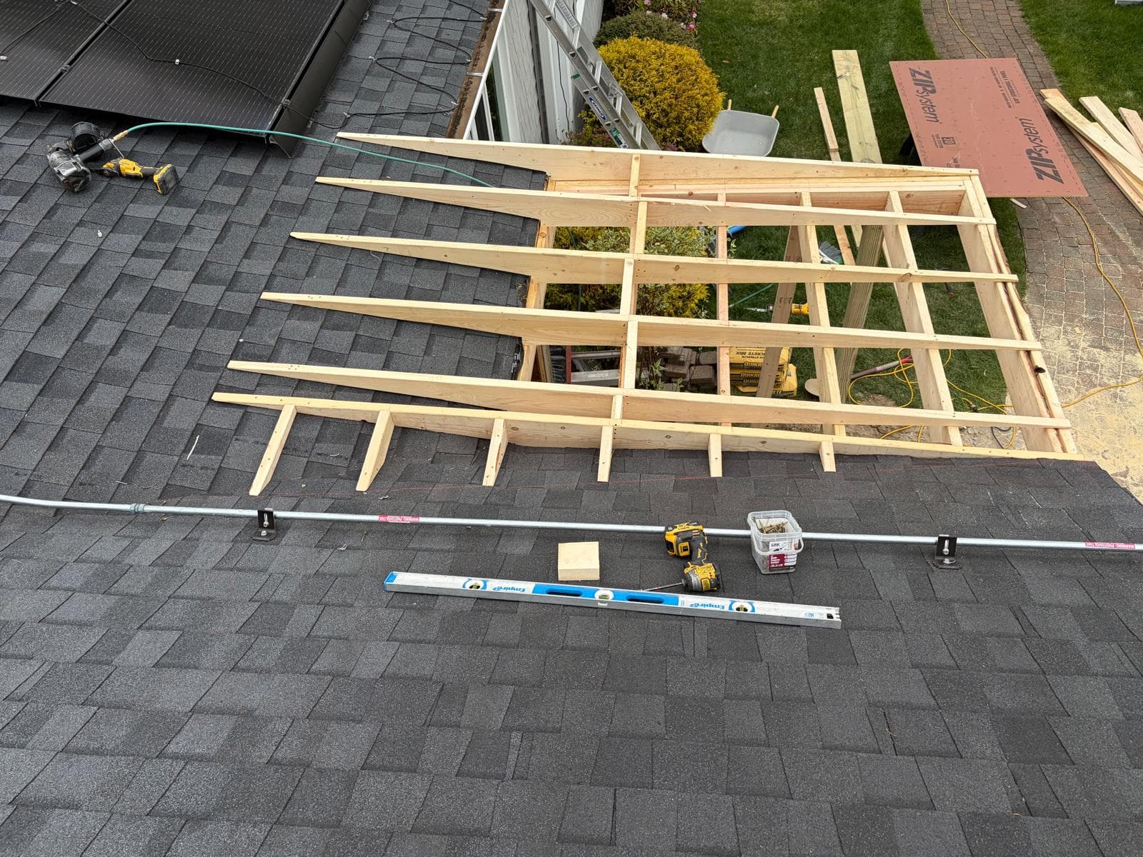 Roof framing aerial showing rafter layout for new porch addition in Webster MA before sheathing