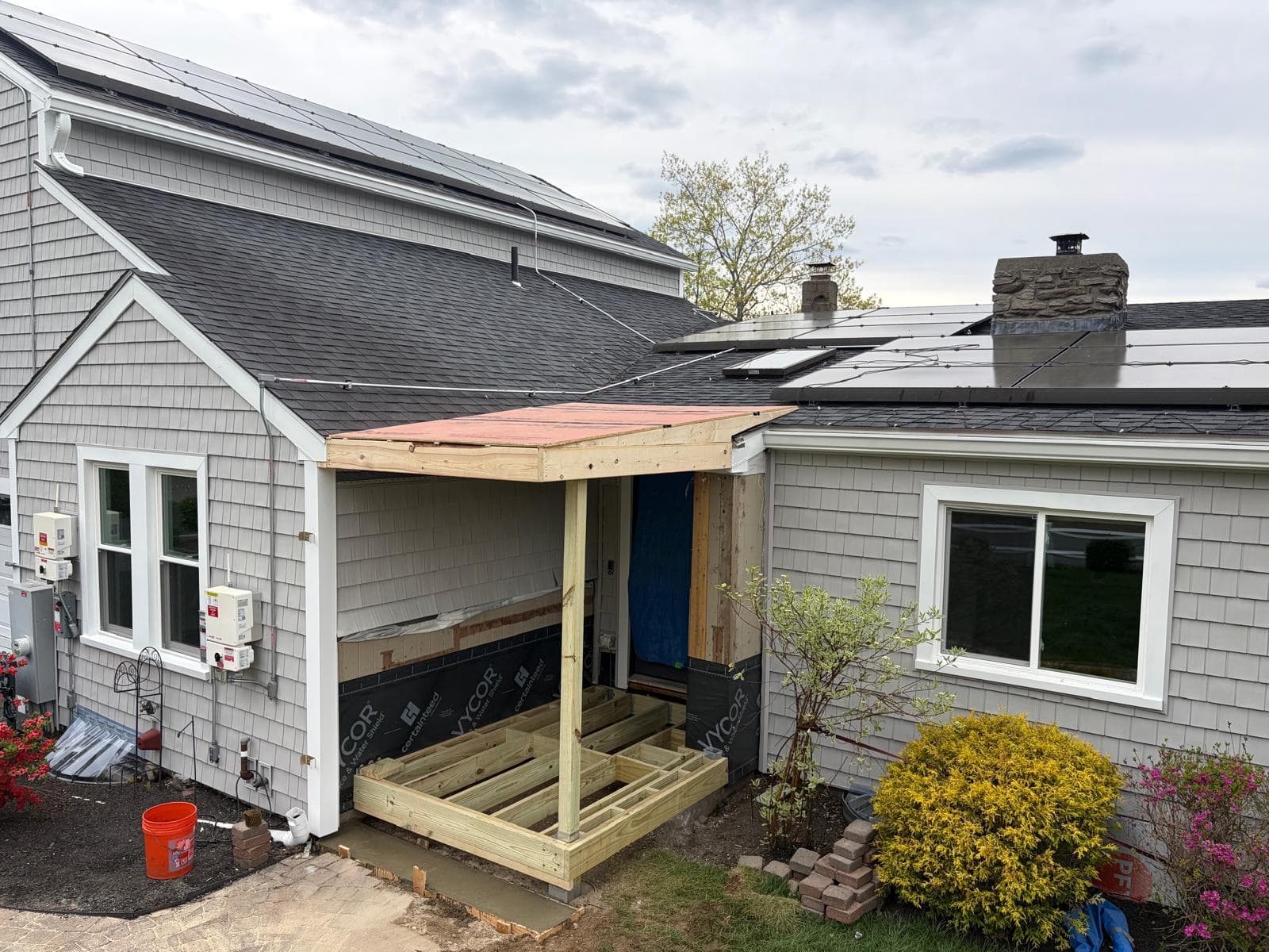 Completed ZIP System roof deck on Webster MA porch addition with taped seams visible from above
