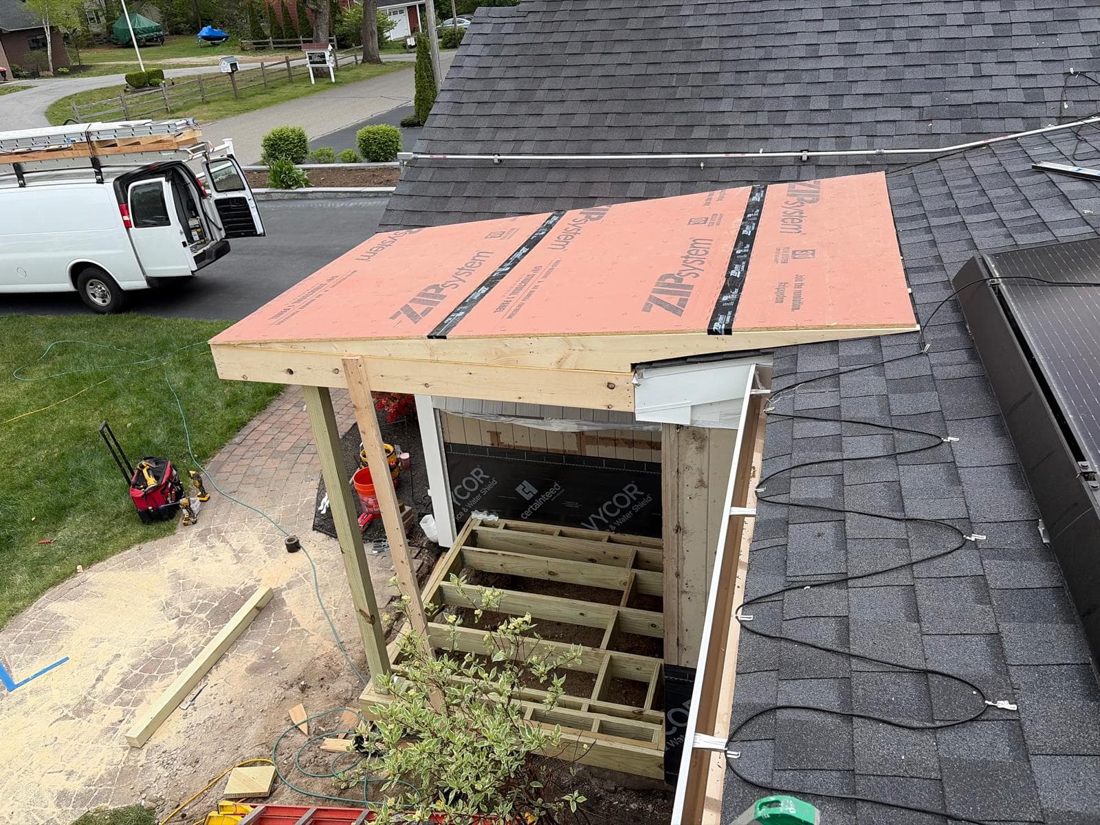 ZIP System sheathing panels installed with factory-taped seams on new porch roof in Webster MA